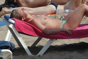 Girls on a nude beach in Sitges, Spain