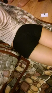 Young Candid Girl in Mini Shorts Lying on Bed, Booty Closeup Home Creepshot