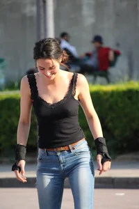 Hot brunette skateboarder in tight jeans and with hard nipples