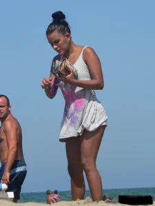Hot ass topless beach girl with great tits lets her little brother oil up her ass in thong bikini