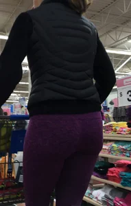 Milf shopping with a nice ass in purple leggings