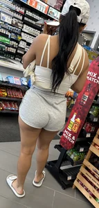 Sexy fit latina with cheeks coming out of booty shorts