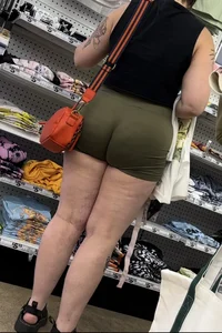 Juicy brunette in green spandex shorts OC