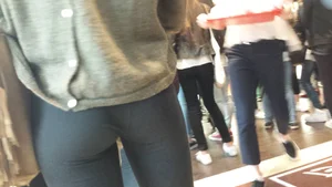 Flat booty in leggings closeup