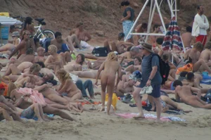 Topless girls on a beach in Barcelona