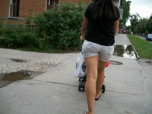 Young Milf in Shorts and Slippers Suburban Street Photos