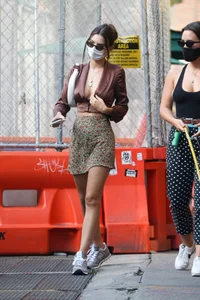 Emily Ratajkowski in mini skirt out for a walk with a friend in New York