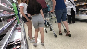 Cute brunette shopping with a nice ass in tight grey shorts with a wedgie