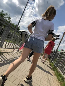 Cute Girl in Denim Shorts Walking Down a Railway Station Gallery