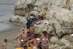 Girls on a nude beach in Sitges, Spain