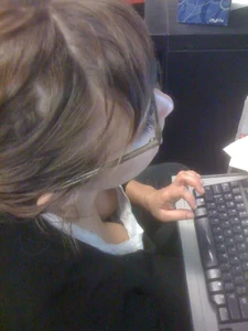 Bespectacled dorky girl with a computer