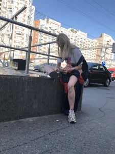 Blonde Girl Busy with Her Smartphone on the Street Candid Gallery