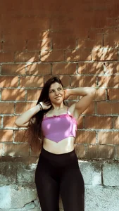 Non-candid hottie in a crop top and leggings