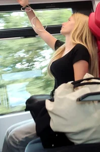 Hot busty blonde on train