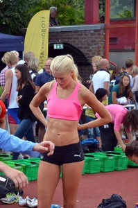 Sexy blonde track sprinter changing after a race