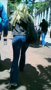 Blonde in tight jeans with her red thong sticking out