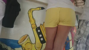 Milf in yellow shorts with vpl and a wedgie