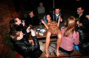 Only one is nude - group photos where only 1 girl is naked, and the rest of the people are dressed
