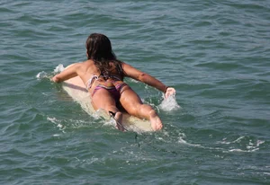 Candid surfer babes on the beach and in bikinis