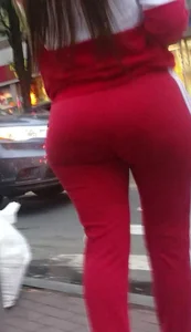 Hot Round Booty in Red Pants Street Closeup