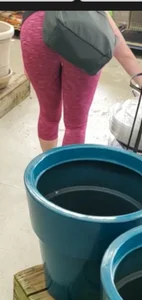 Milf shopping with a nice ass in tight maroon leggings