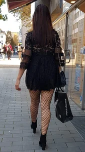 Hot candid masked girl wearing a dress and fishnet pantyhose street creepshots, nice cleavage too