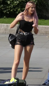 Tall blonde and pink haired girl showing her ass cheeks