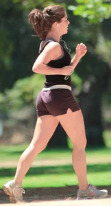 Cute girl running in short shorts
