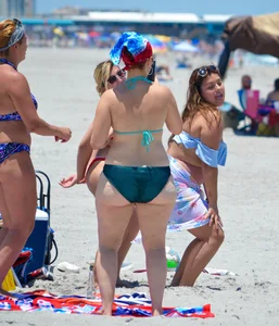 Chubby white girls in bikinis on the beach