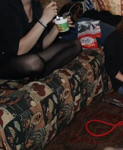 Girl’s Crossed Legs in Black Pantyhose on the Couch - Creepshot at Home