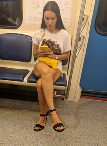 Hot Girl in Sandals Sitting with Her Legs Crossed in a Subway Train Creepshot