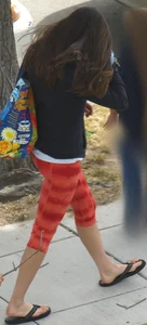 Beautiful brunette teen in orange patterned leggings