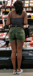 Ebony chick grocery shopping in green shorts
