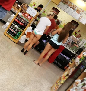 Hot Girl in a T-shirt And a Swimsuit Bottom at the Store Candid Pic