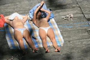 Two teens stripping and going topless to tan