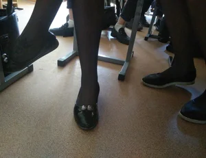 Crossed Teen Legs in Black Pantyhose And Feet in Flats Under Desk Classroom Creepshot