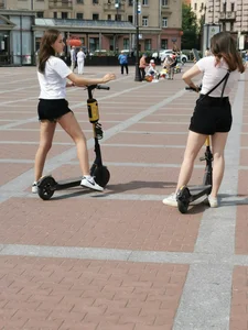 Couple of candid teen in shorts with scooters on the street creepshots, hot pale legs