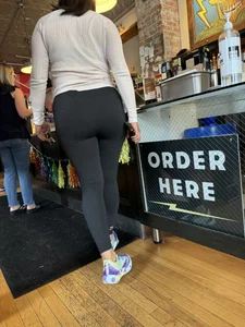Big ass girl In tights at cafe