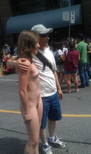 Nude small boobed girl at Toronto pride parade with a couple bonus girls