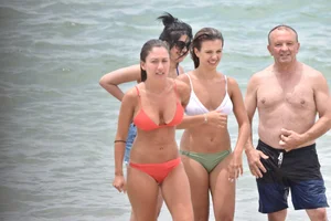 Two sexy ass girls on the beach in bikinis