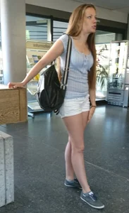 Pretty blonde babe with nice legs in white denim shorts