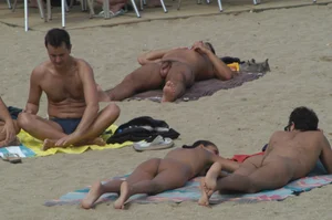 Topless girls on a beach in Barcelona