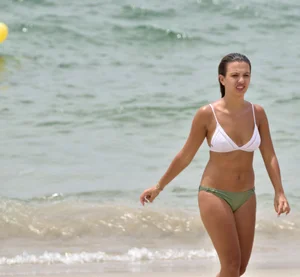 Two sexy ass girls on the beach in bikinis