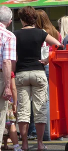 Round butt in shorts street creepshot
