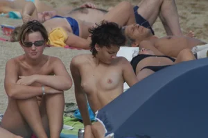 Topless girls on a beach in Barcelona