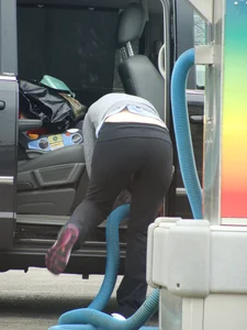 Girls cleaning their cars in jeans and pants