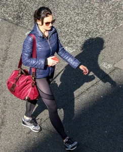 Brunette lady in leggings out walking