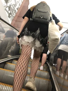 Cute Girl in Lacey Semi-Transparent Dress and Fishnet Pantyhose Subway Escalator Candid Photos Gallery