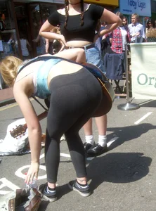 Hot Teen Blonde in a Top and Yoga Pants Playing Guitar on the City Street Candid Archive