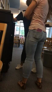 Very cute teen candid girl wearing tight jeans with a phone in back pocket